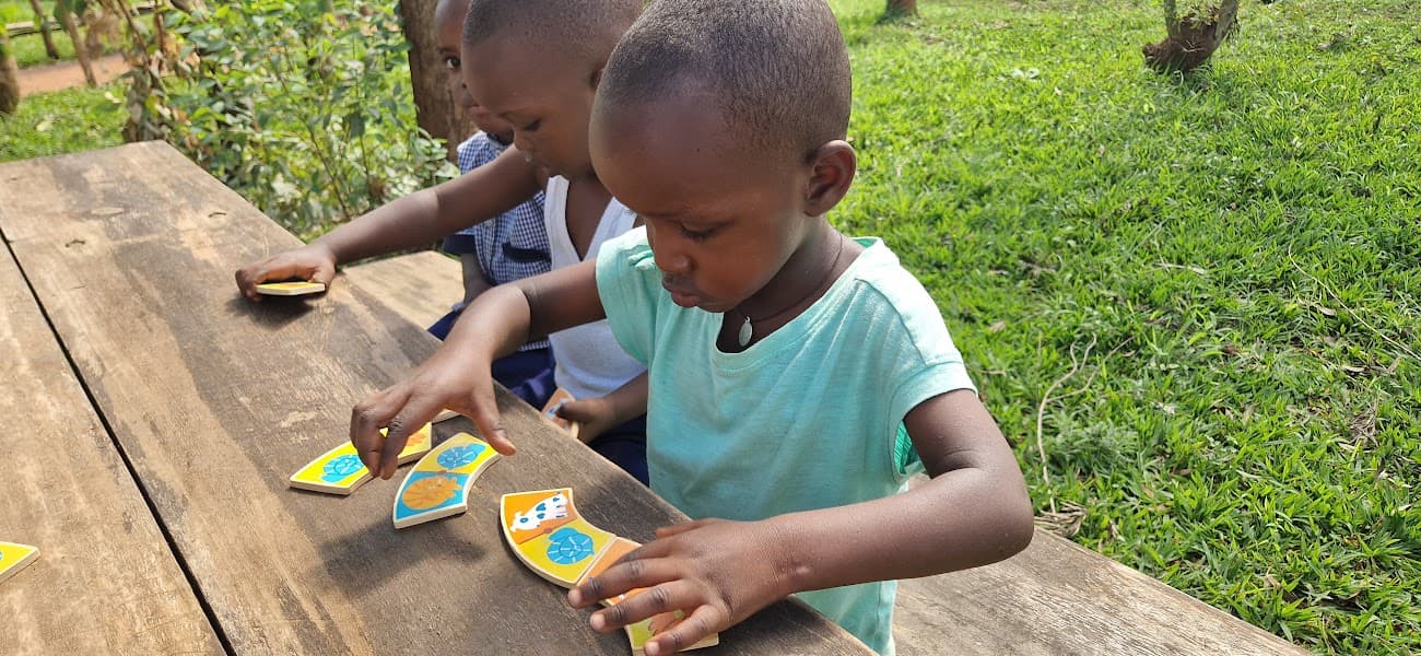 A child discovering a learning game with friends