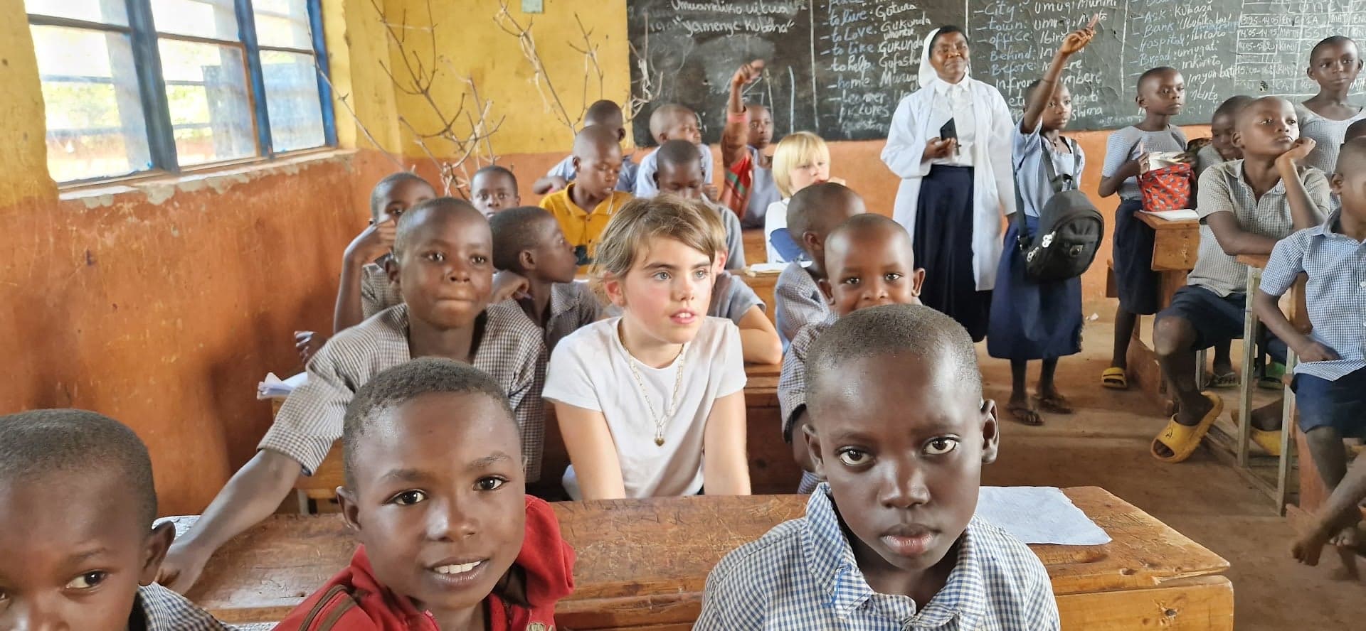 A young donor meeting the children of Nyankora